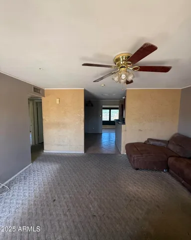a view of workspace with furniture and a potted plant