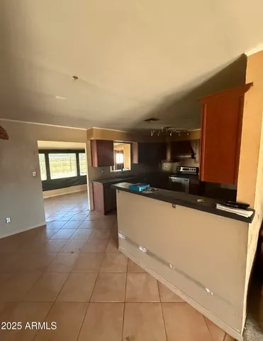 a living room with hard wood floors and a fireplace