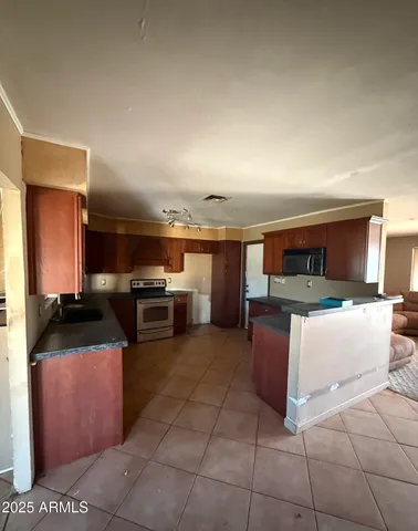 a kitchen with a sink and counter top space