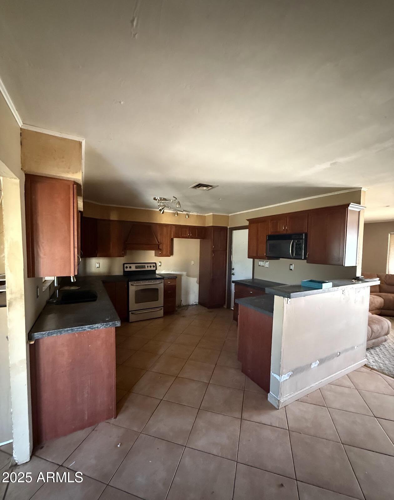 2615 North Yucca Street Chandler, AZ 85224 - Photo 10 of 38 a kitchen with a sink and counter top space
