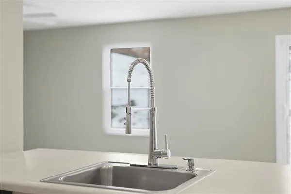 a close view of a sink and mirror