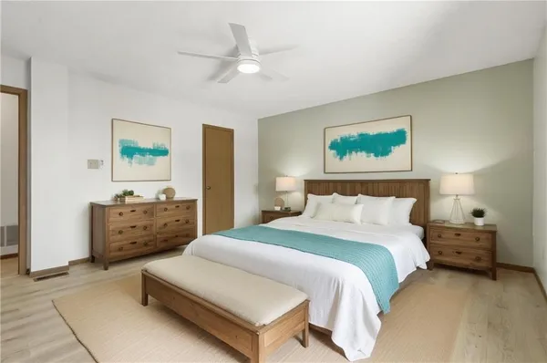 a bedroom with a bed and a dresser