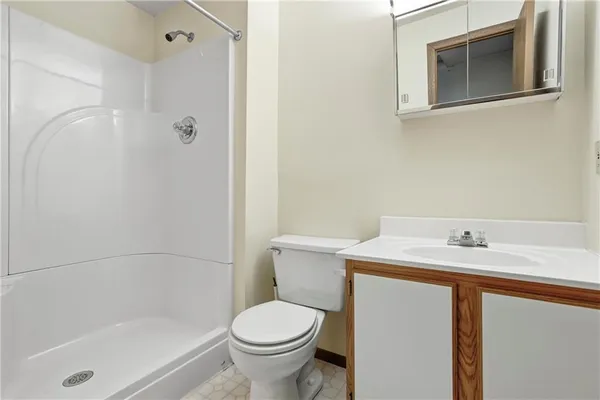 a bedroom with furniture and a flat screen tv