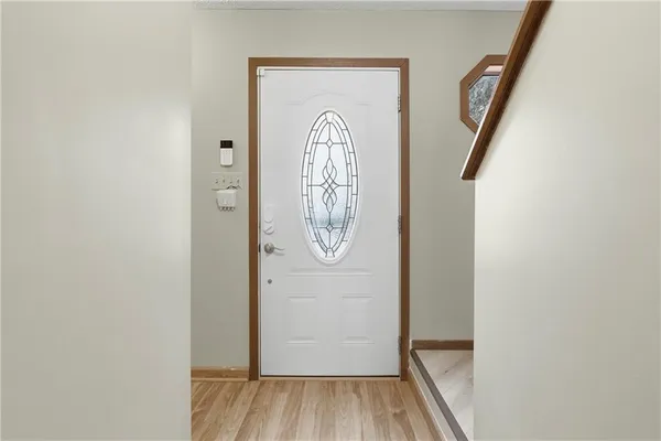 a view of entryway with wooden floor