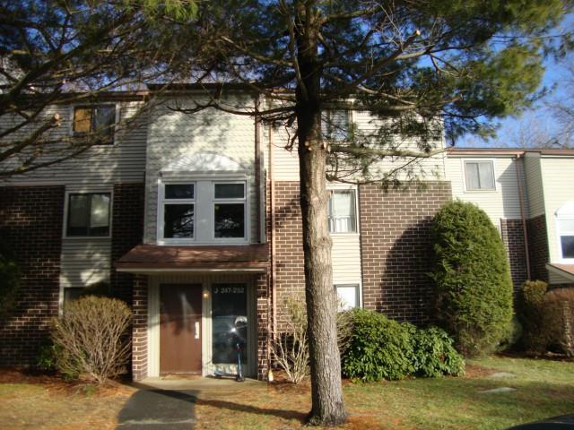 7 Padanaram Road, Unit 250 Danbury, CT 06811 - Photo 1 of 1 a front view of a house with garden