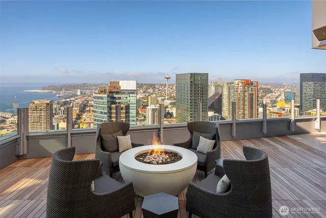 a living room with furniture a rug and a large window
