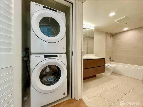 a view of a hallway with washer and dryer