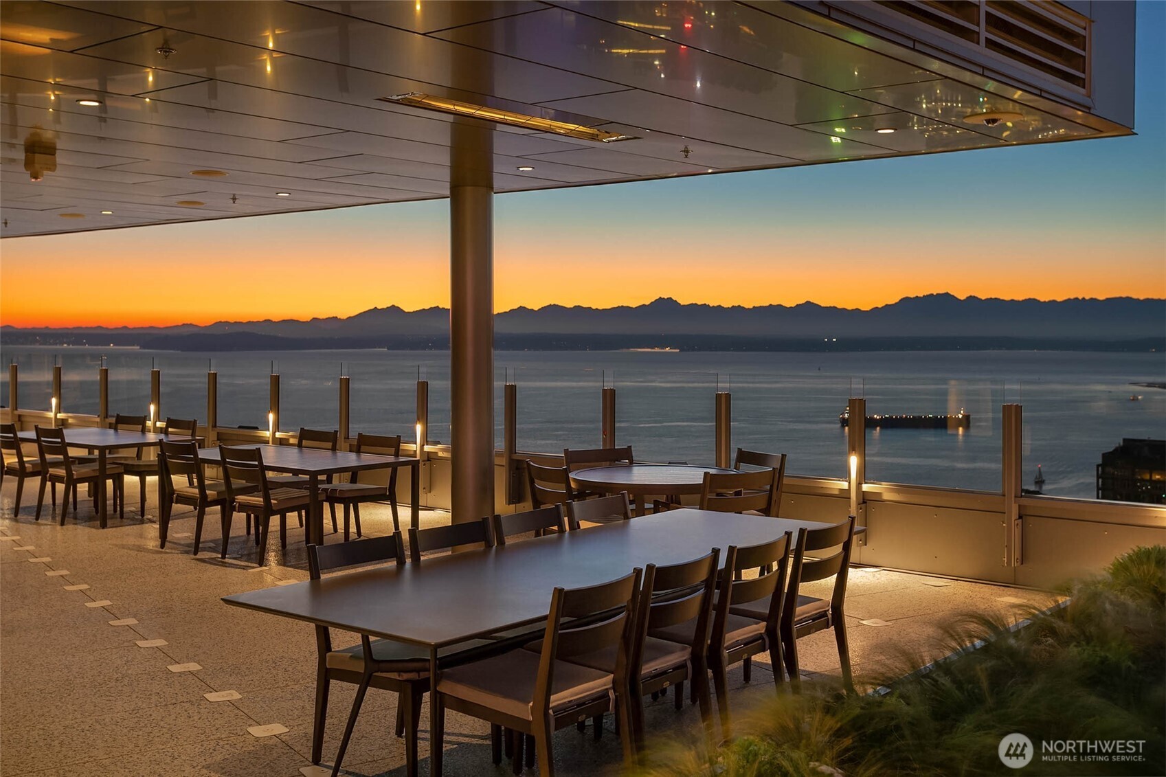 121 Stewart Street, Unit 401 Seattle, WA 98101 - Photo 6 of 29 a view of a patio with table and chairs