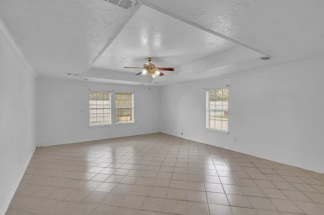 a view of an empty room with a window