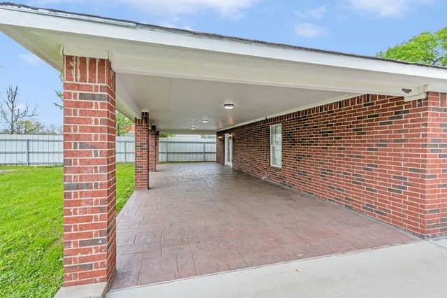 a view of a plants with a fence
