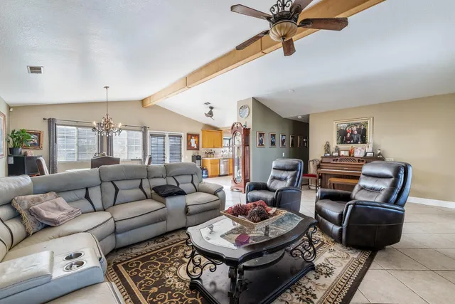 a living room with furniture and a rug
