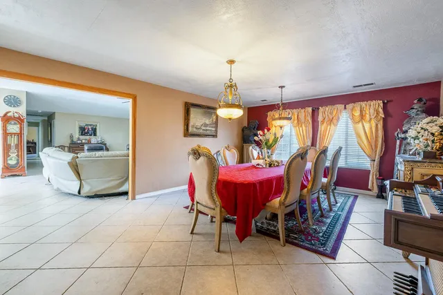 a view of a dining room with furniture window and outside view