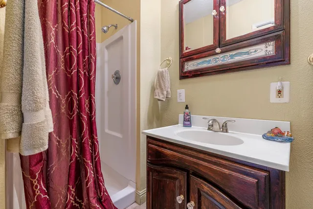 a bathroom with a sink and a mirror