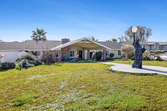 a swimming pool view with a outdoor seating