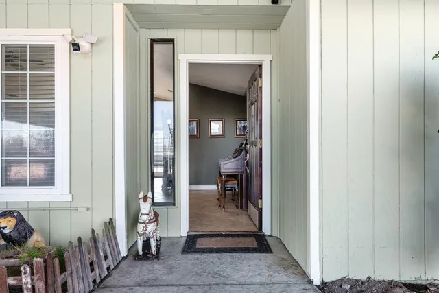 a view of a hallway with a outdoor space