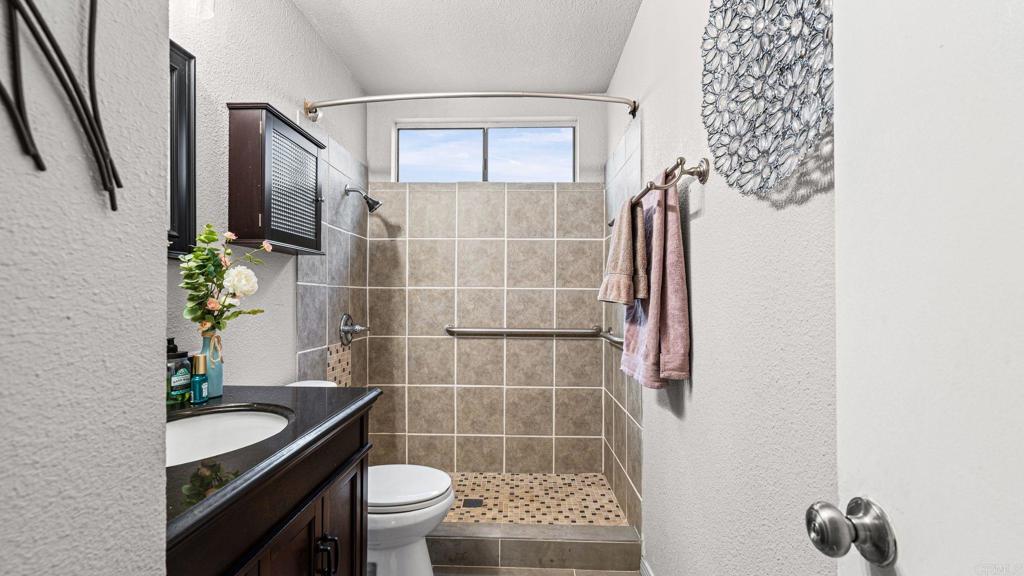 12741 Laurel Street, Unit 34 Lakeside, CA 92040 - Photo 11 of 30 a bathroom with a toilet and a shower