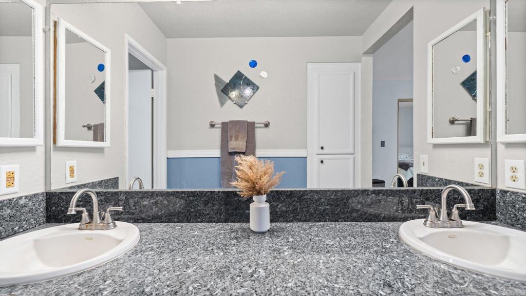 12741 Laurel Street, Unit 34 Lakeside, CA 92040 - Photo 17 of 30 a bathroom with a sink and a mirror