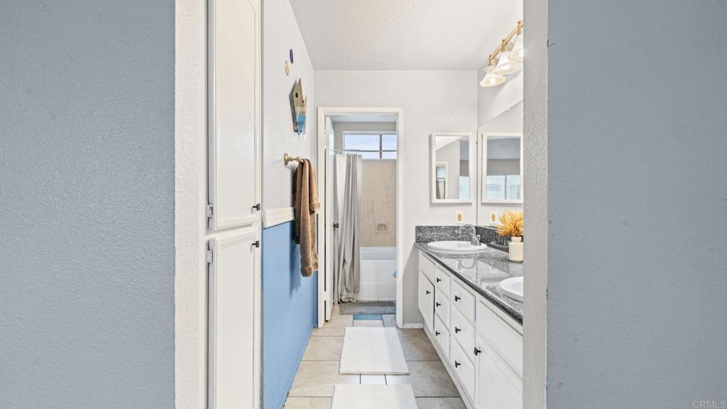 12741 Laurel Street, Unit 34 Lakeside, CA 92040 - Photo 19 of 30 a large white kitchen with a stove and a refrigerator