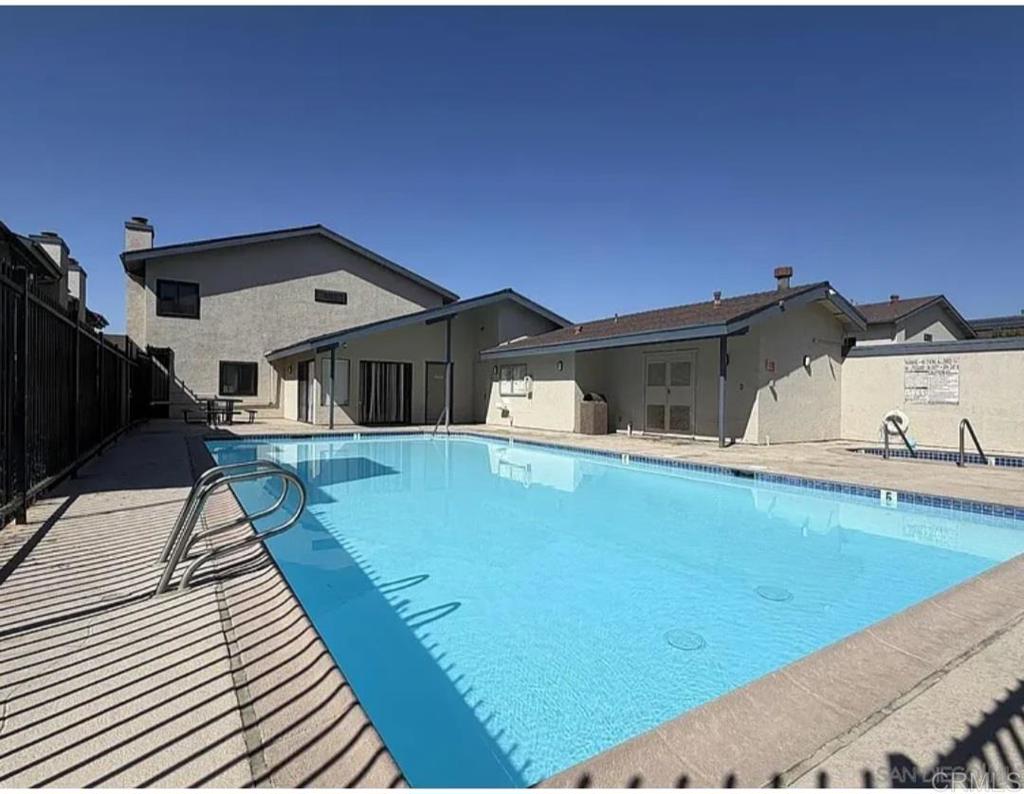 12741 Laurel Street, Unit 34 Lakeside, CA 92040 - Photo 30 of 30 a front view of a house with swimming pool