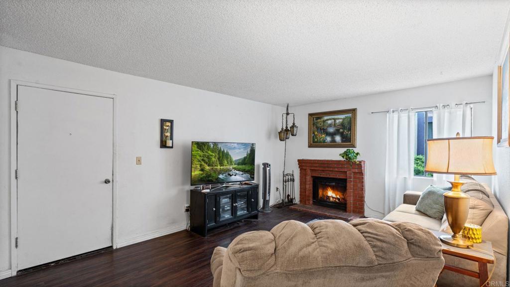 12741 Laurel Street, Unit 34 Lakeside, CA 92040 - Photo 4 of 36 a bedroom with a bed and a flat screen tv