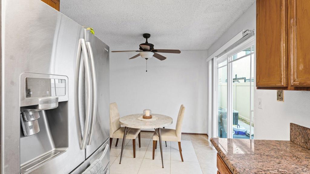 12741 Laurel Street, Unit 34 Lakeside, CA 92040 - Photo 9 of 30 a view of a dining room with furniture window and wooden floor