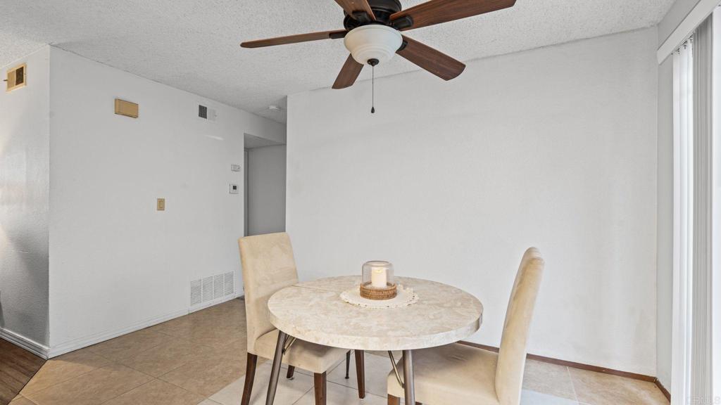 12741 Laurel Street, Unit 34 Lakeside, CA 92040 - Photo 10 of 30 a view of a dining room with furniture and wooden floor