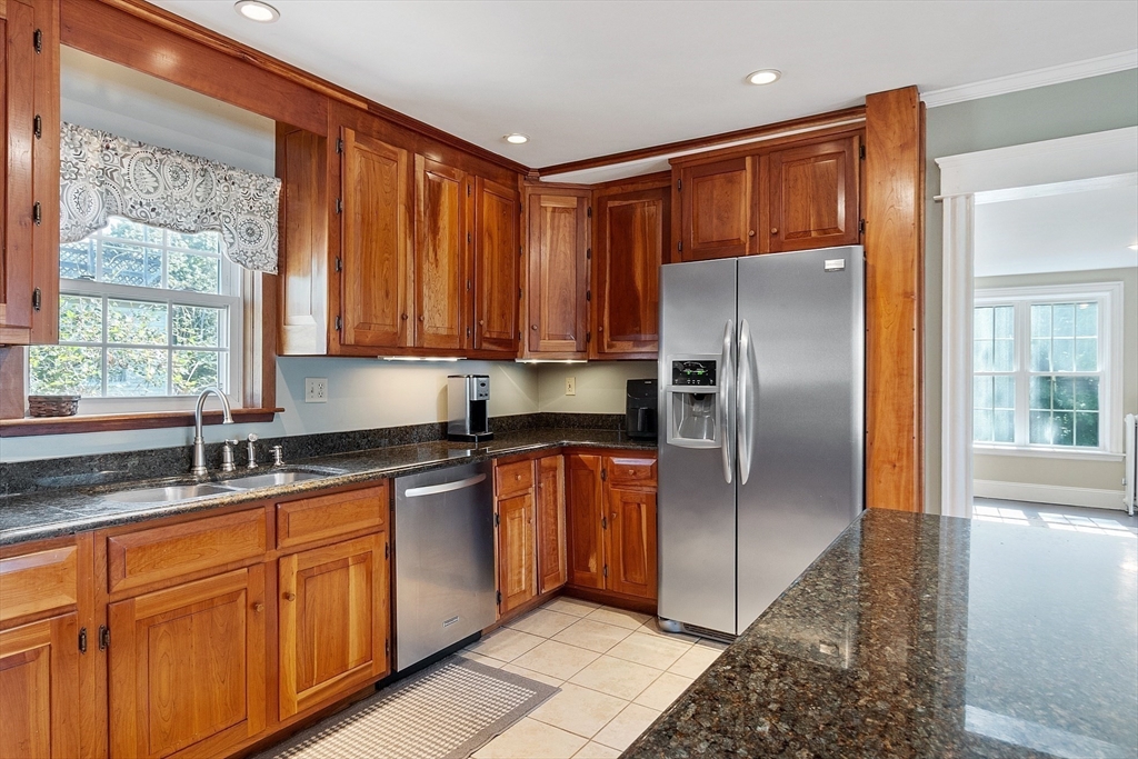 64 Central Street Gardner, MA 01440 - Photo 14 of 42 a kitchen with stainless steel appliances granite countertop a refrigerator and a sink