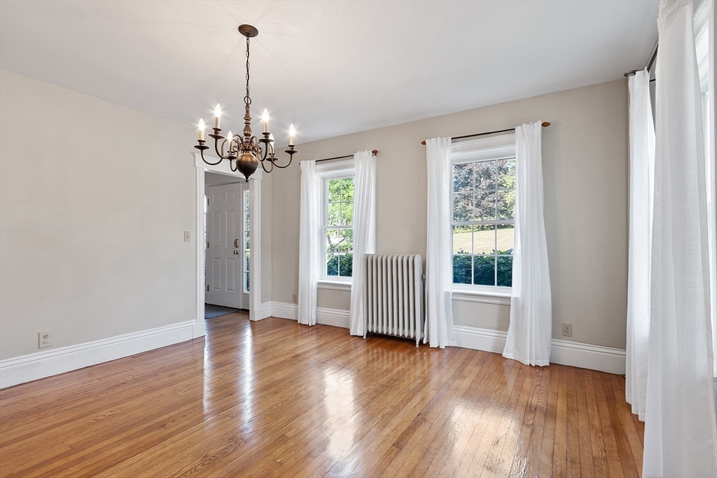 64 Central Street Gardner, MA 01440 - Photo 17 of 42 a view of a room with wooden floor chandeliers and kitchen view