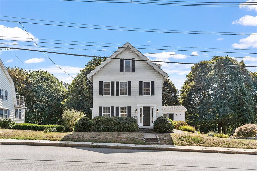 64 Central Street Gardner, MA 01440 - Photo 2 of 42 a view of a white house next to yard