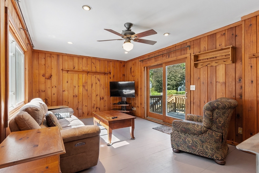 64 Central Street Gardner, MA 01440 - Photo 23 of 42 a living room with furniture ceiling fan and a window