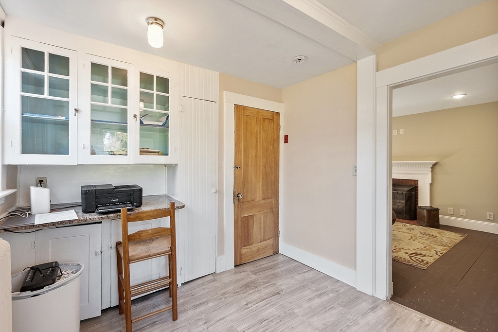 64 Central Street Gardner, MA 01440 - Photo 27 of 42 a view of workspace with wooden floor and windows