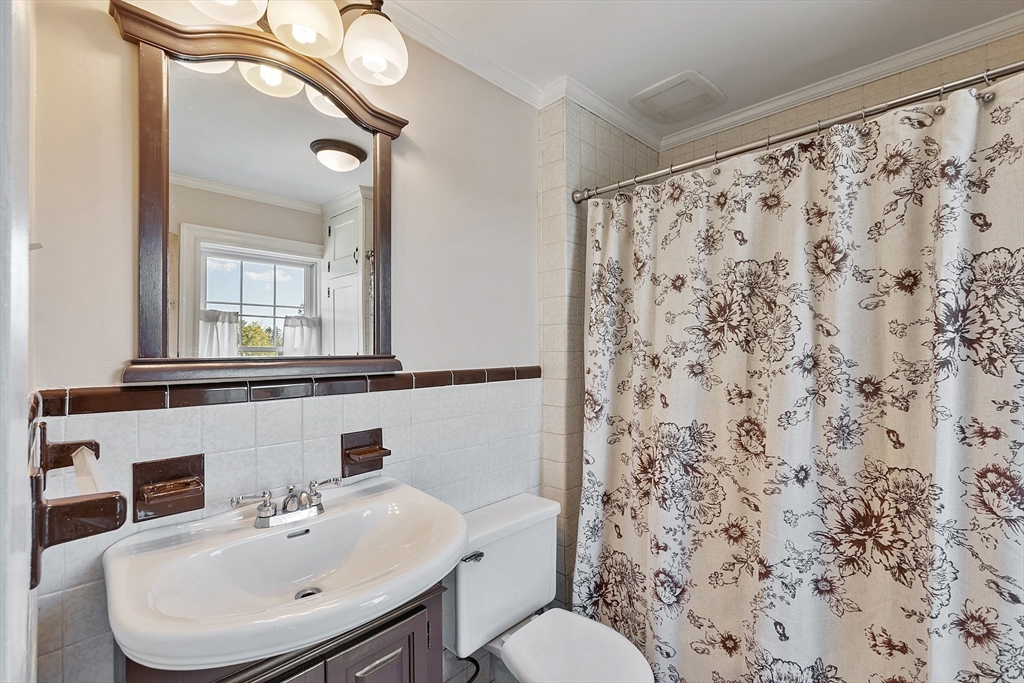 64 Central Street Gardner, MA 01440 - Photo 35 of 42 a bathroom with a sink toilet and mirror