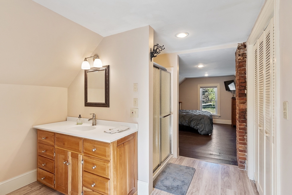 64 Central Street Gardner, MA 01440 - Photo 40 of 42 a en suite bathroom with a sink and a mirror