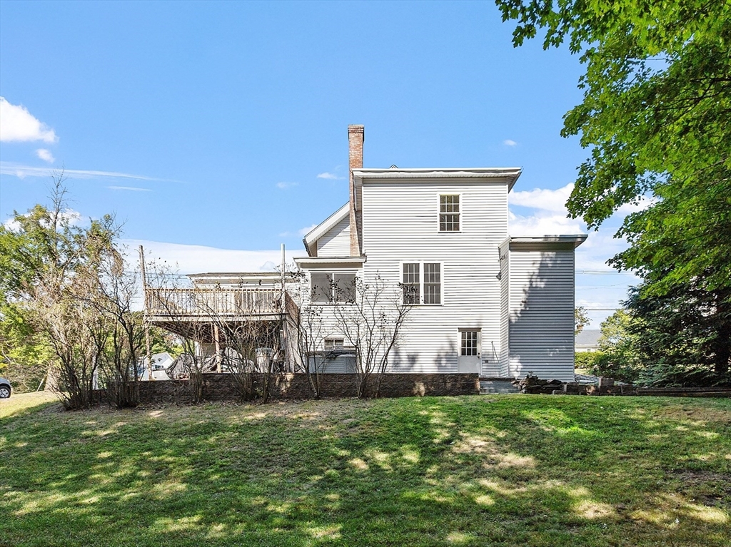 64 Central Street Gardner, MA 01440 - Photo 4 of 42 a view of a house with a yard