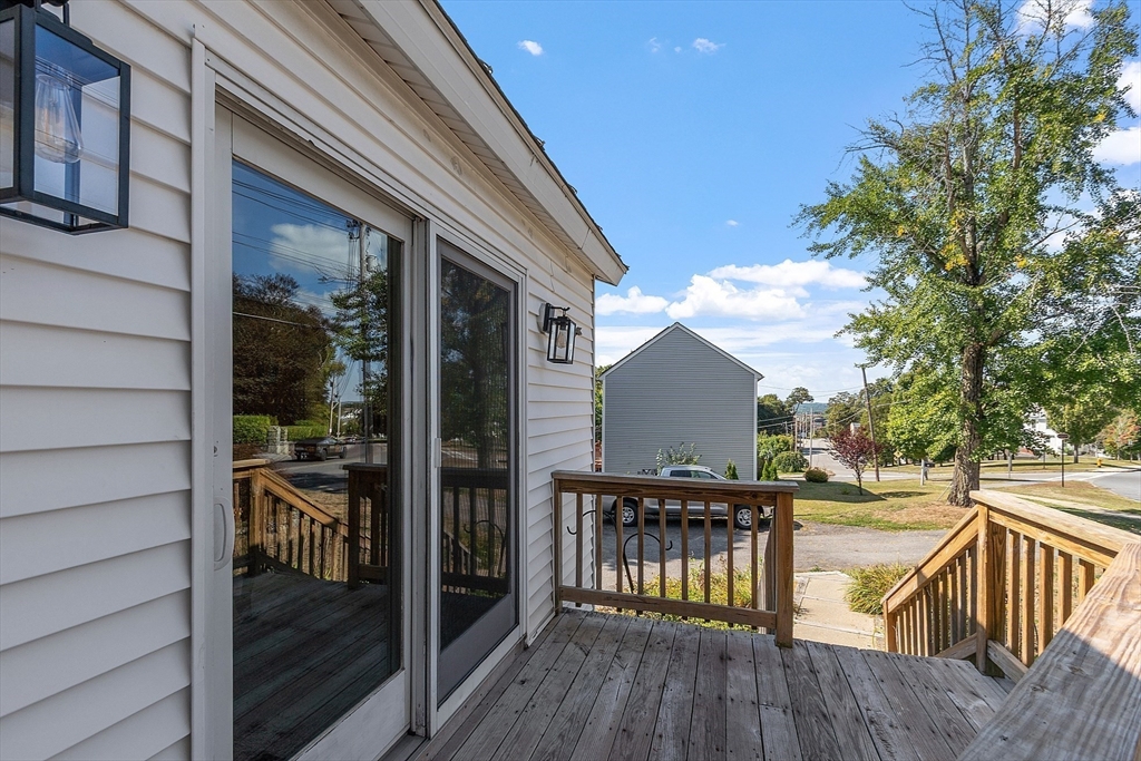 64 Central Street Gardner, MA 01440 - Photo 42 of 42 a view of a balcony with two chairs and wooden floor
