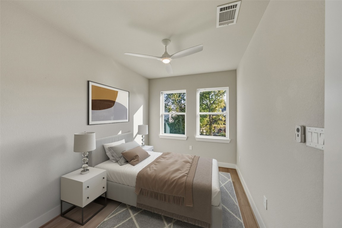 3422 Elser Street Houston, TX 77009 - Photo 14 of 26 This bedroom features a modern, minimalist design with neutral tones. Virtually staged, creating a serene atmosphere.