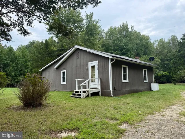 a backyard of a house with seating space