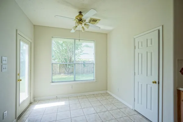 a view of an empty room with a window