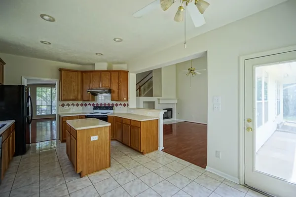 a kitchen with a refrigerator and a sink