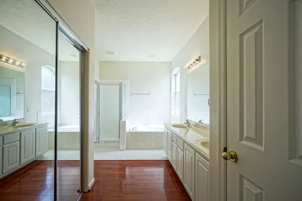 a bathroom with a shower and a sink