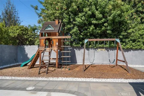 a house with trees in the background