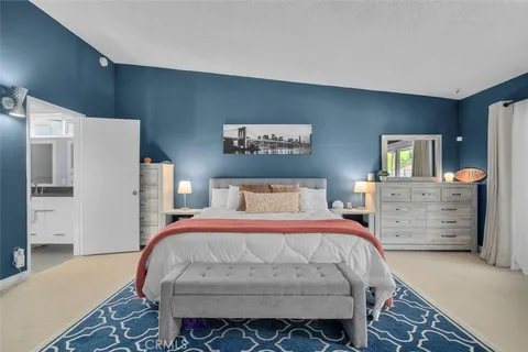 a bedroom with a bed and furniture