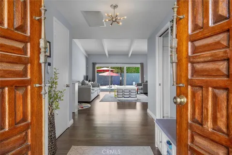 a view of an entryway and livingroom with furniture