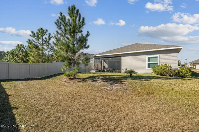 a view of a yard and car parked