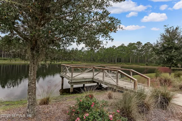 an aerial view of a house with a lake view