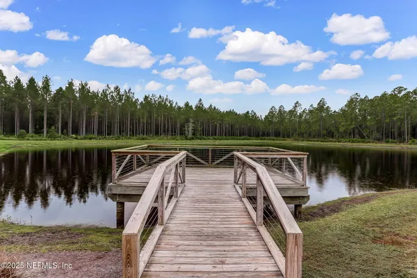 an aerial view of a houses with a city street