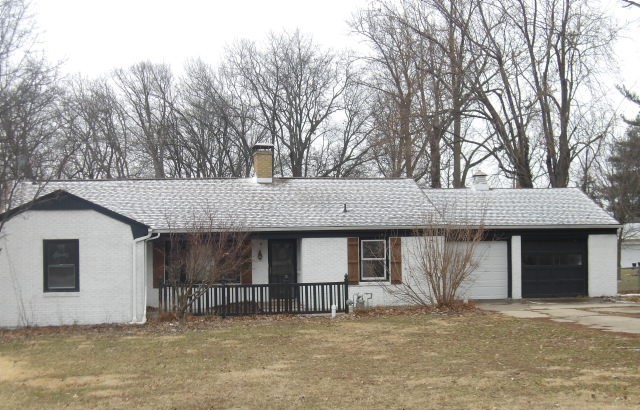 a front view of a house with a garage