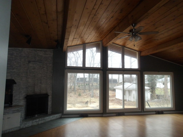 13 Southern Drive Decatur, IL 62521 - Photo 4 of 29 a view of an empty room with a window and wooden floor