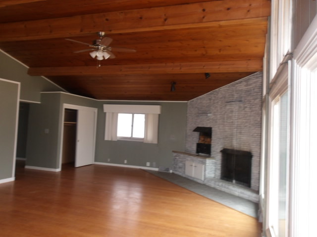 13 Southern Drive Decatur, IL 62521 - Photo 6 of 29 a view of empty room with wooden floor and fan