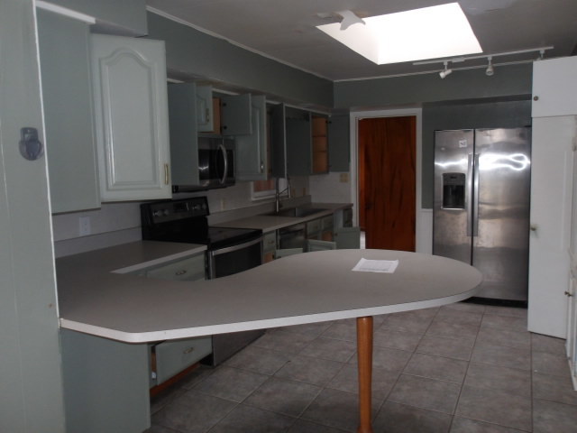 13 Southern Drive Decatur, IL 62521 - Photo 8 of 29 a view of kitchen with cabinets and refrigerator